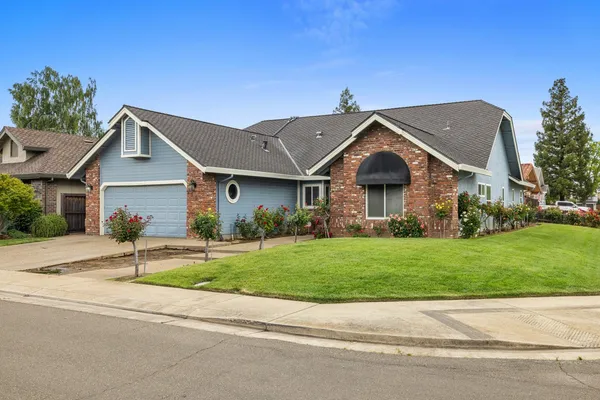 a front view of a house with a yard