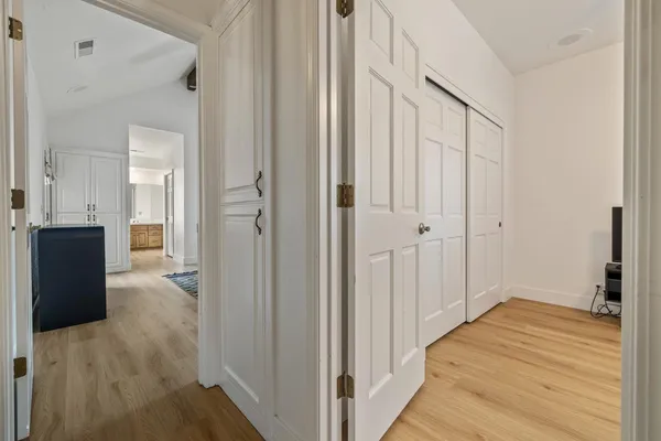 a bedroom with a bed and a ceiling fan