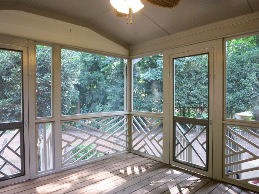 704 Currituck Drive Raleigh, NC 27609 - Photo 21 of 25 The Screened Porch off the Dining Rm has bead board ceiling & CF and steps out to the grilling Deck. Screened Porch