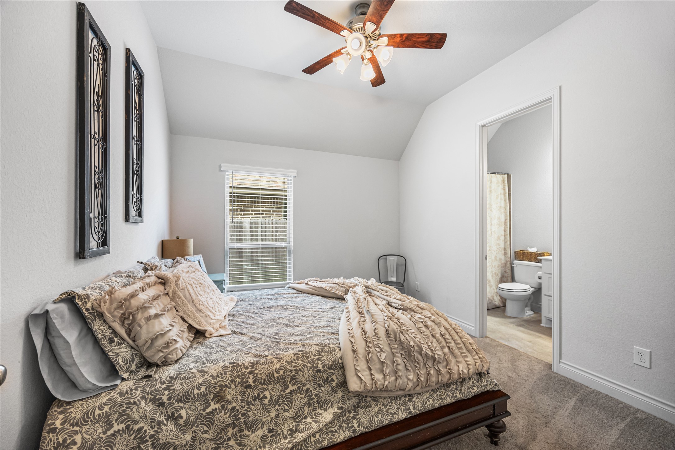 28169 Knight Peak Drive Spring, TX 77386 - Photo 19 of 33 a bedroom with a bed and a window