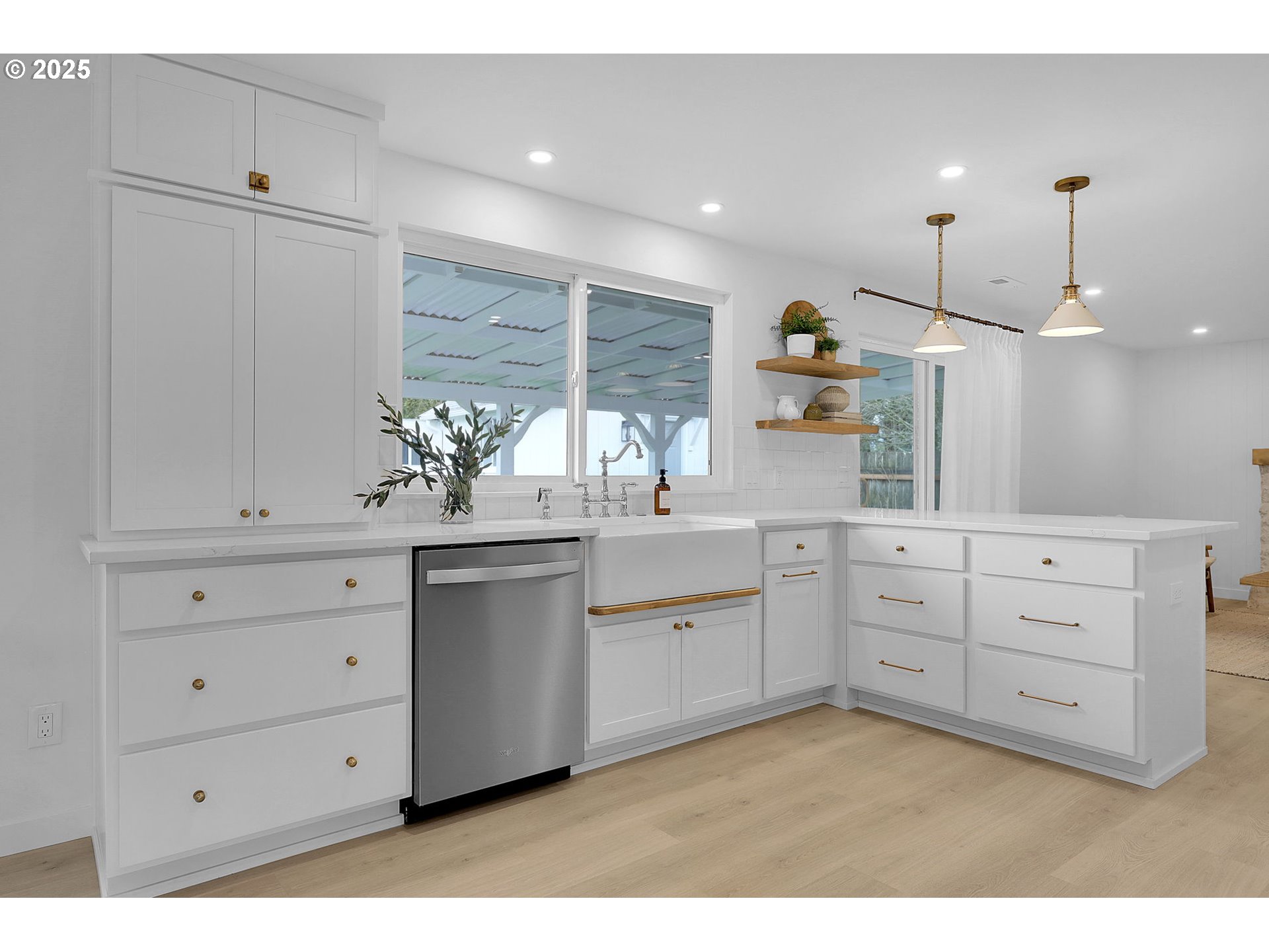 1090 Dixie Drive Springfield, OR 97478 - Photo 13 of 48 a kitchen with white cabinets and window