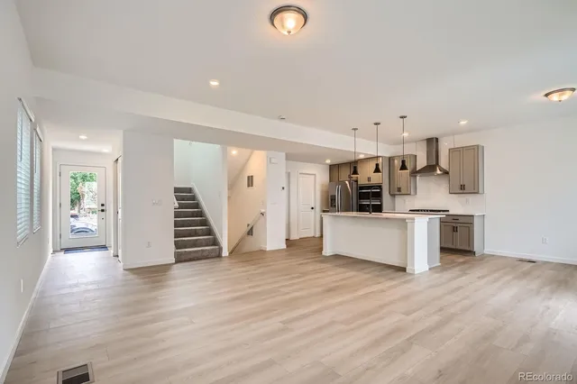 a view of kitchen with stainless steel appliances refrigerator oven and stove
