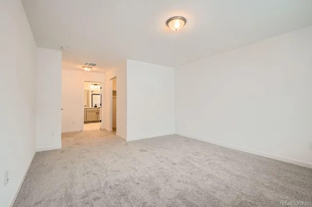 an empty room with a bathroom