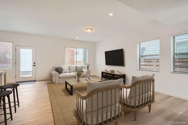 a living room with furniture fireplace and a flat screen tv