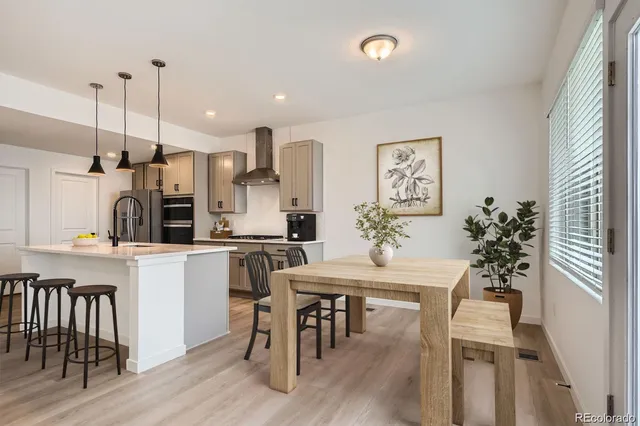 a kitchen with a table and chairs in it