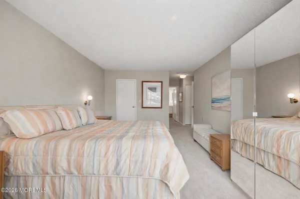 a living room with furniture a table and a large window