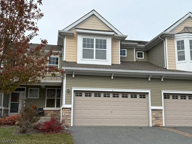 a view of a house with a yard and plants