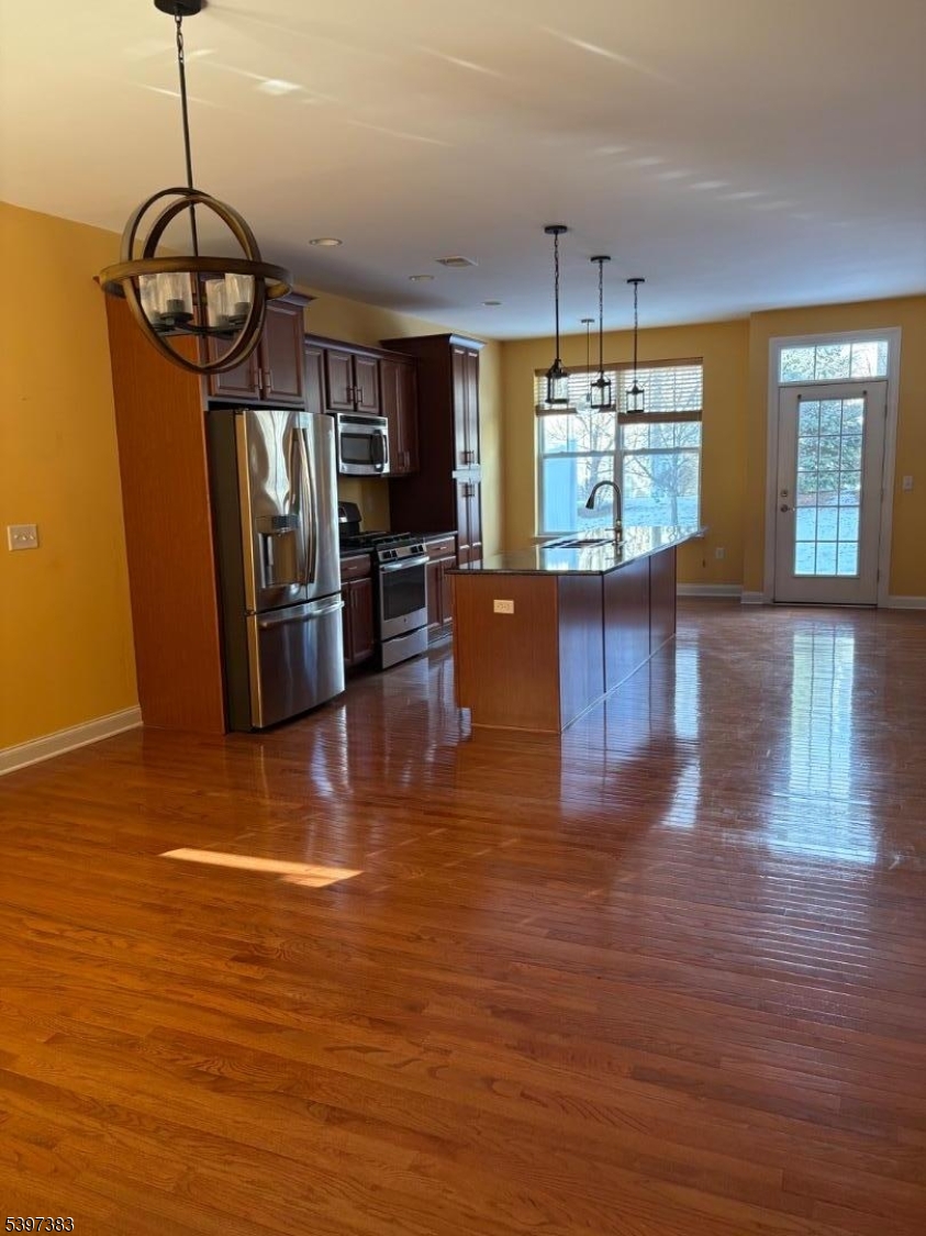 17 Alexanders Road Hackettstown, NJ 07840 - Photo 12 of 14 a view of a livingroom with furniture window wooden floor and chandelier
