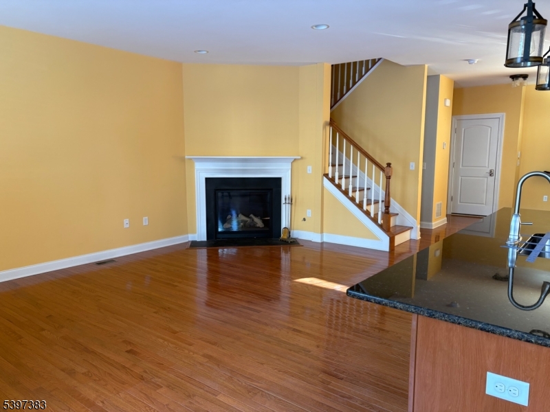 17 Alexanders Road Hackettstown, NJ 07840 - Photo 14 of 14 a view of a livingroom with wooden floor and a staircase