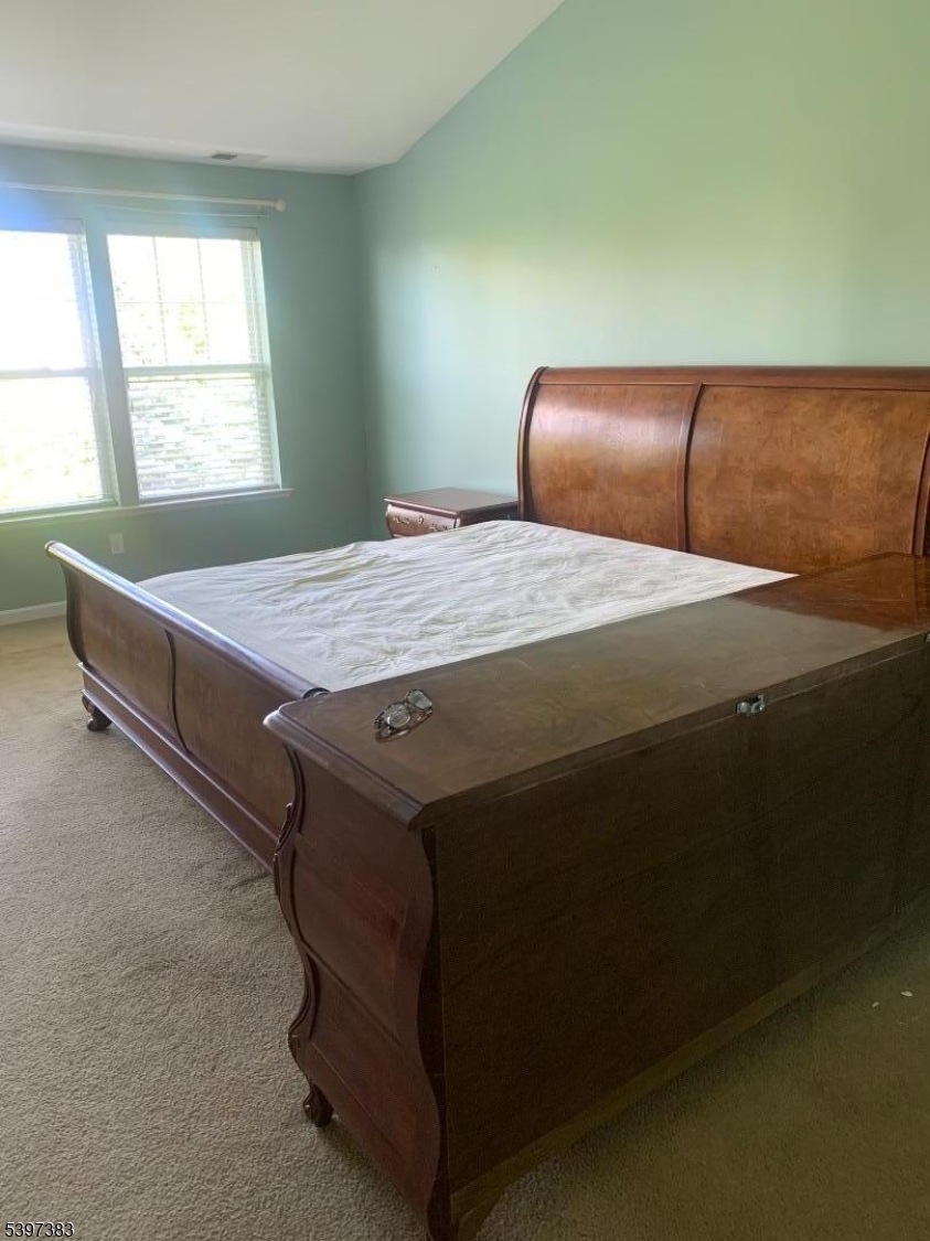 17 Alexanders Road Hackettstown, NJ 07840 - Photo 2 of 14 a bedroom with a bed and window