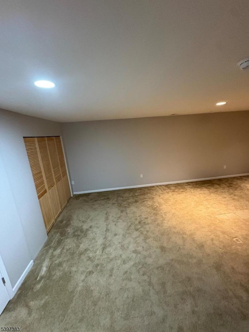 17 Alexanders Road Hackettstown, NJ 07840 - Photo 4 of 14 an empty room with a natural light