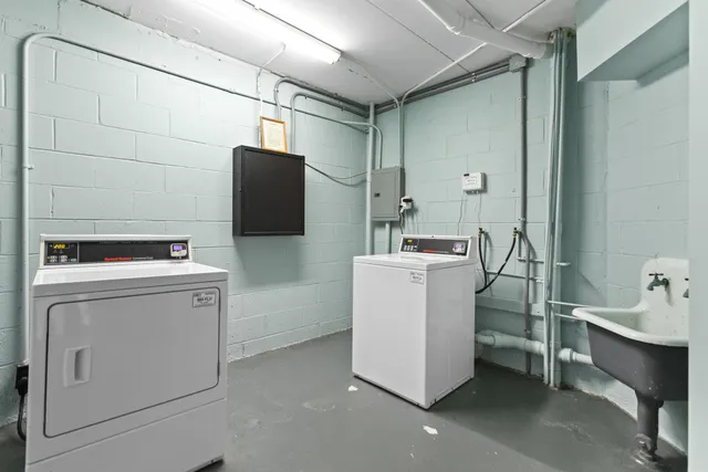 a view of a swimming pool with a patio and plants