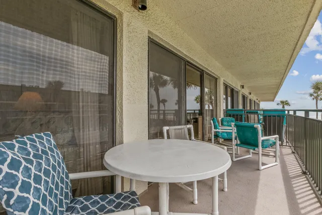 a view of a swimming pool with a garden and plants