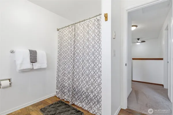 a bathroom with a shower curtain