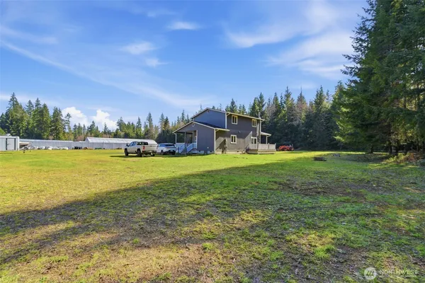 a view of a house with a big yard