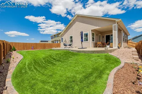a view of a backyard with a garden
