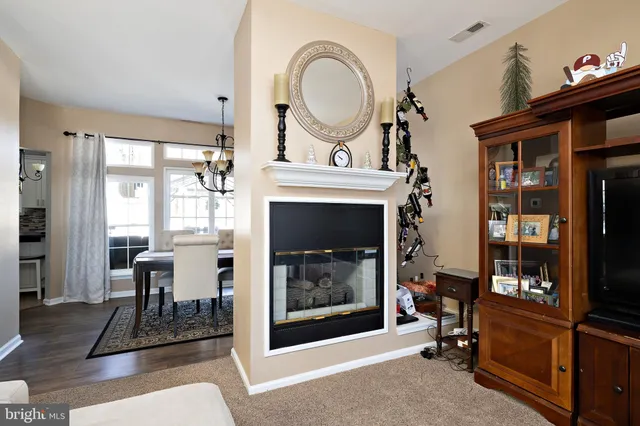a kitchen with stainless steel appliances a stove a sink and a refrigerator