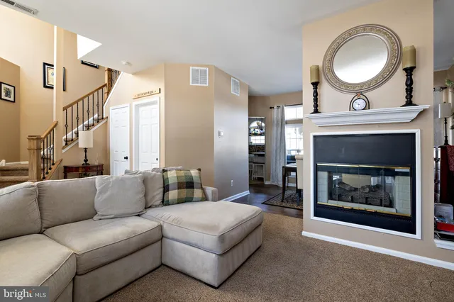 a kitchen with a stove a sink and cabinets