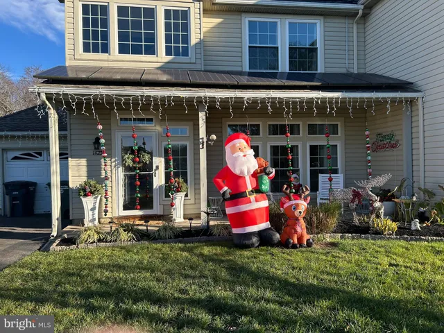 a front view of a building with outdoor seating