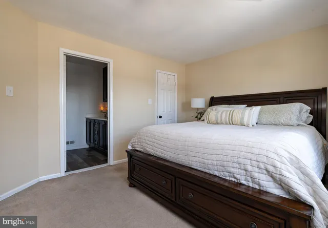 a bedroom with furniture and a flat screen tv