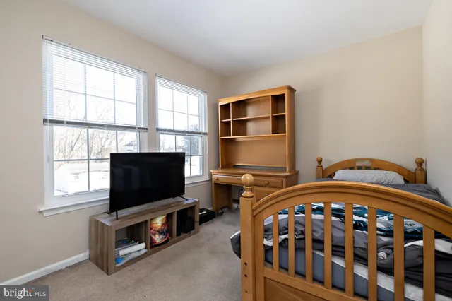 a view of a house with a snow on the road