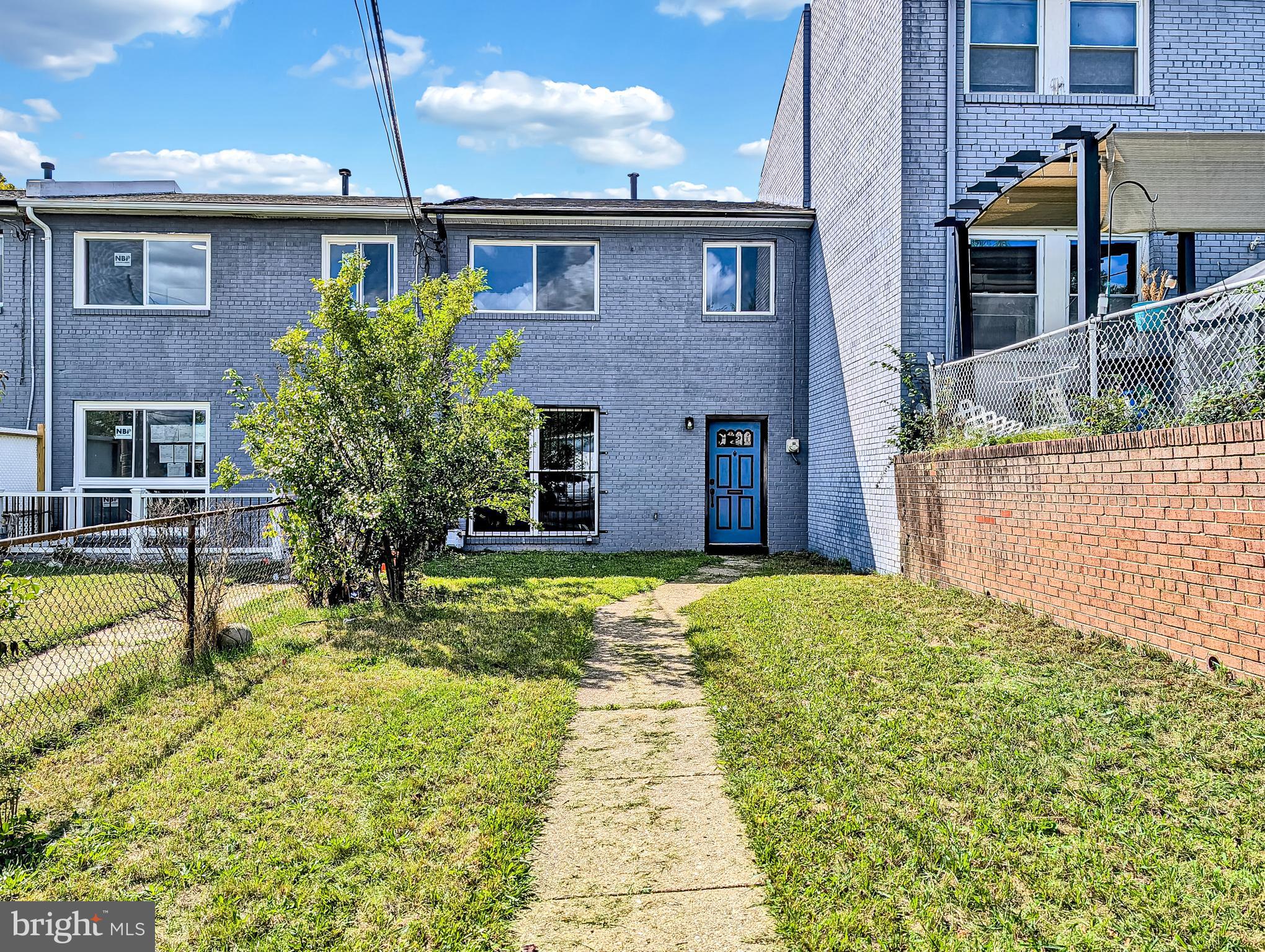 2240 15th Street Northeast Washington, DC 20018 - Photo 2 of 22 a front view of a house with a yard