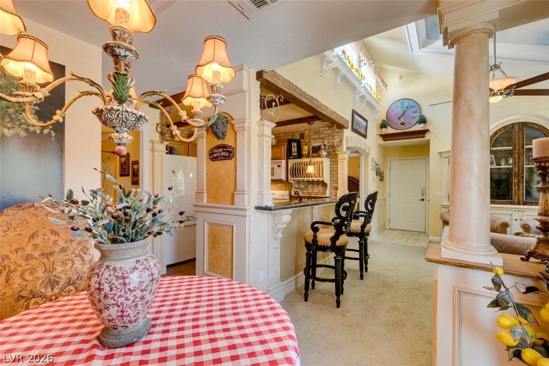 9325 West Desert Inn Road, Unit 244 Las Vegas, NV 89117 - Photo 19 of 55 Ornate fixtures and sun-filled spaces define this inviting living area.