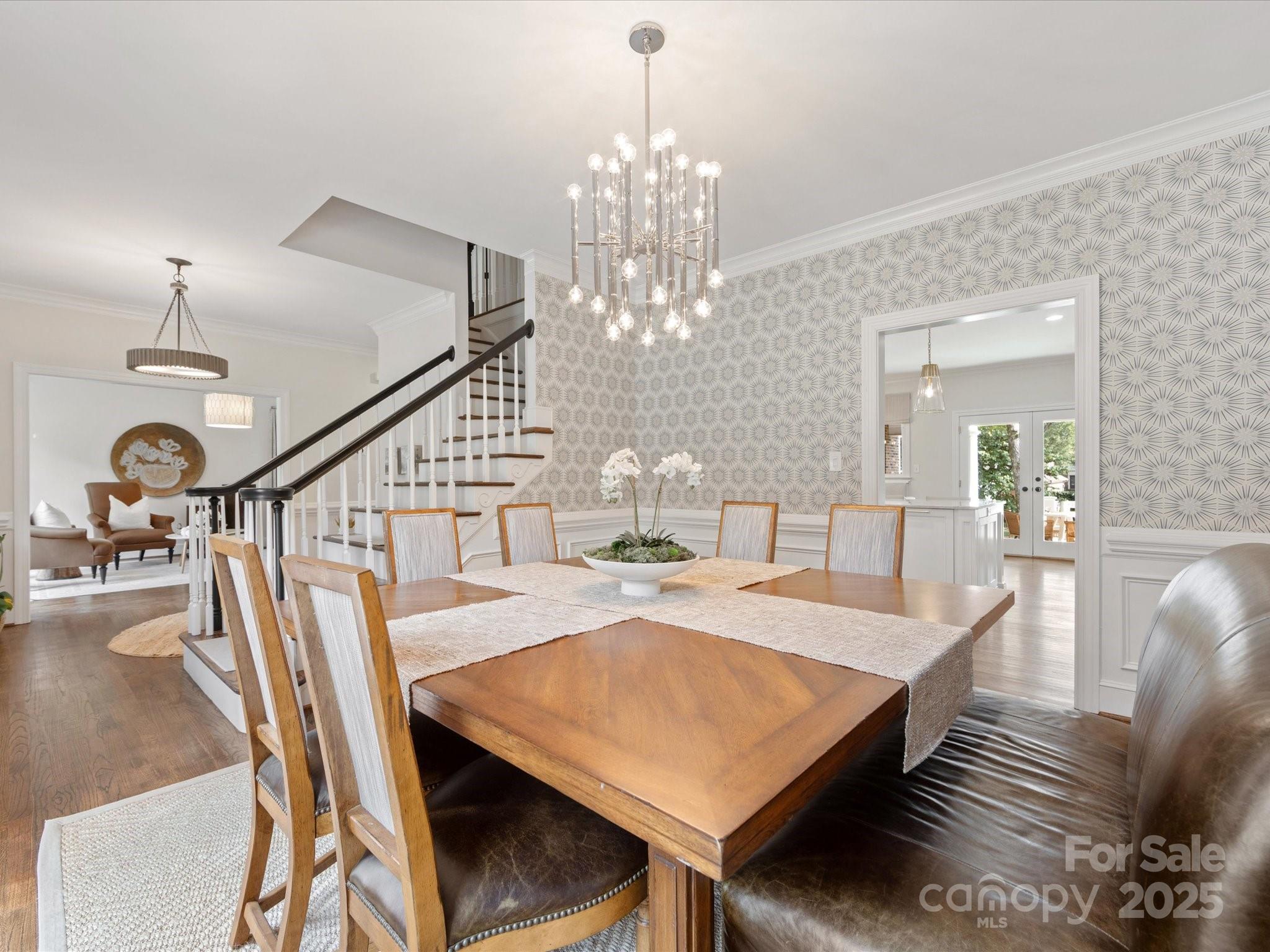 3137 Broadfield Road Charlotte, NC 28226 - Photo 11 of 42 a view of a dining room with furniture and a chandelier