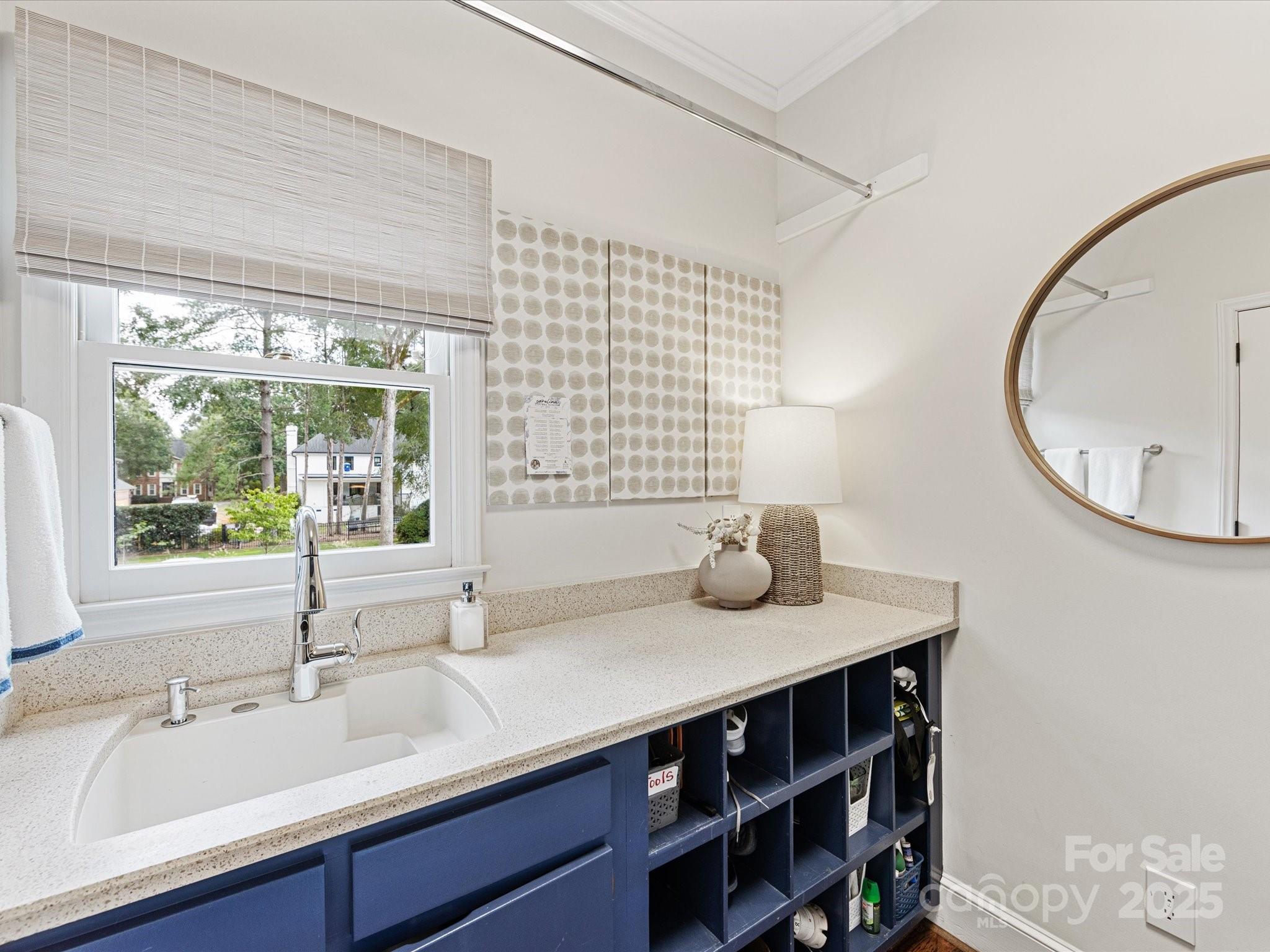 3137 Broadfield Road Charlotte, NC 28226 - Photo 15 of 42 a bathroom with a sink and a mirror