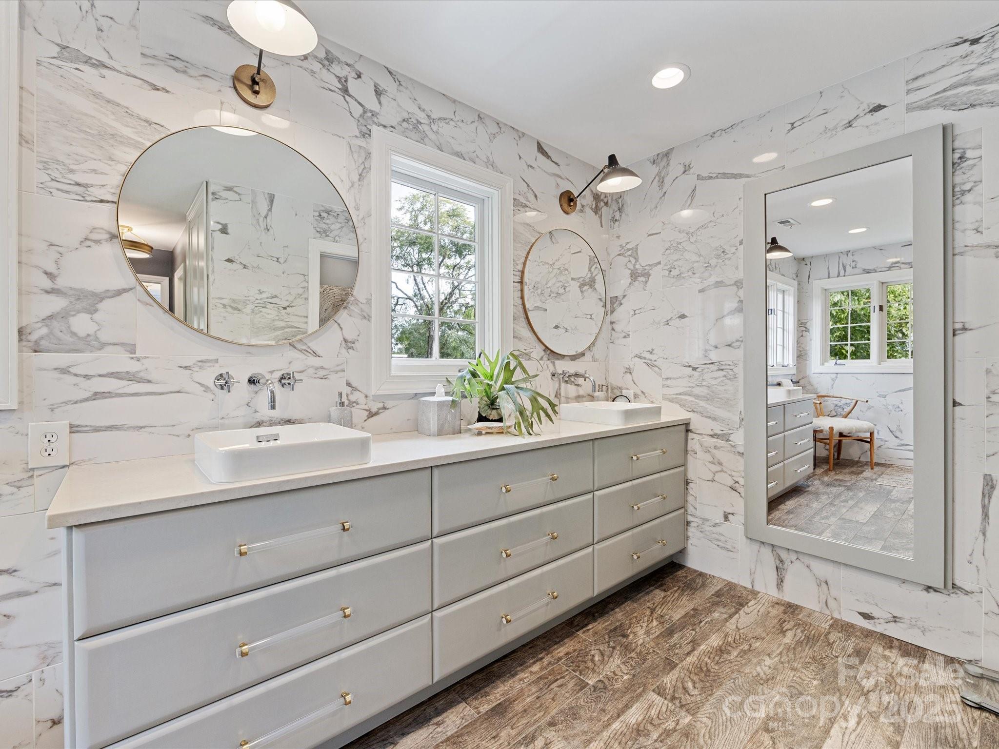 3137 Broadfield Road Charlotte, NC 28226 - Photo 20 of 42 a bathroom with a double vanity sink mirror and shower