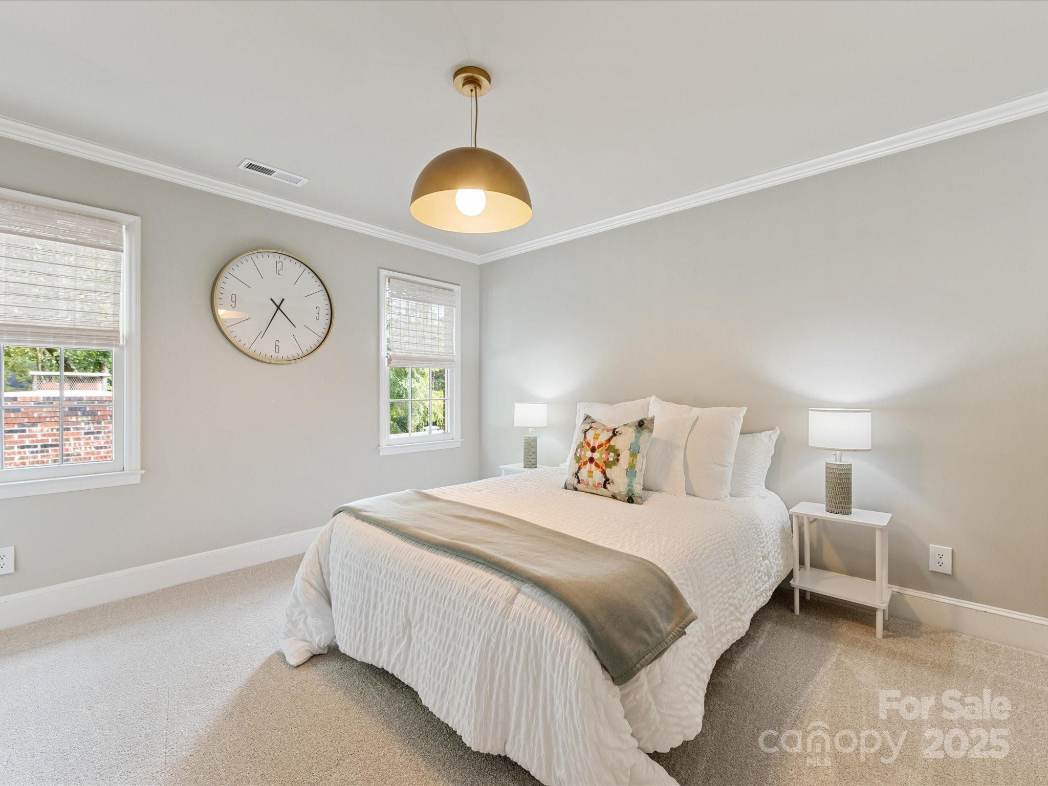 3137 Broadfield Road Charlotte, NC 28226 - Photo 24 of 42 a bedroom with a bed and a window