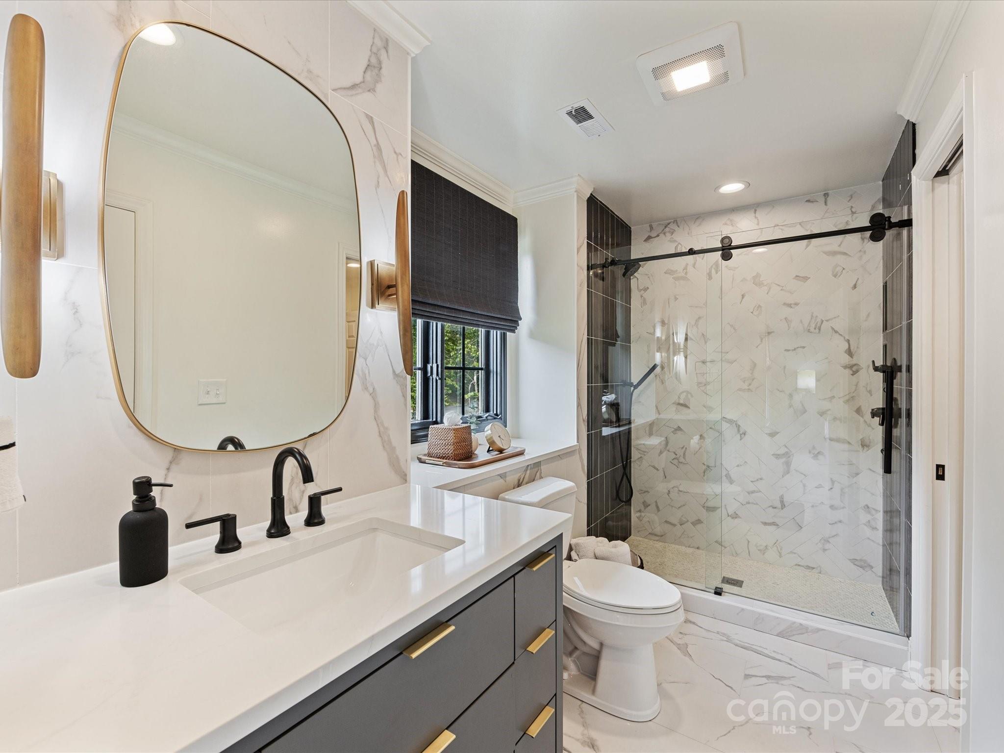 3137 Broadfield Road Charlotte, NC 28226 - Photo 26 of 42 a bathroom with a sink a toilet and shower