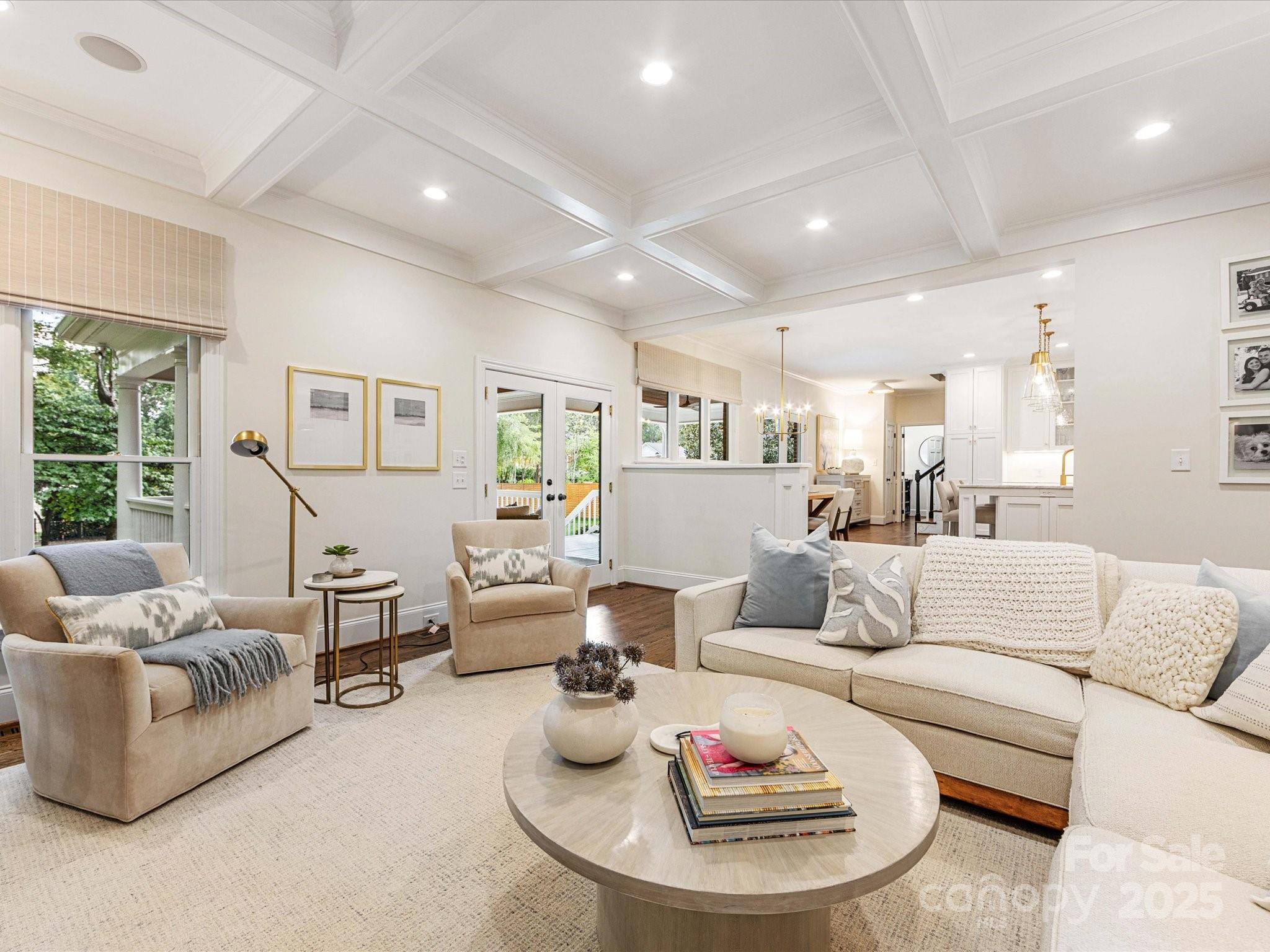 3137 Broadfield Road Charlotte, NC 28226 - Photo 3 of 42 a living room with furniture and a dining table with wooden floor