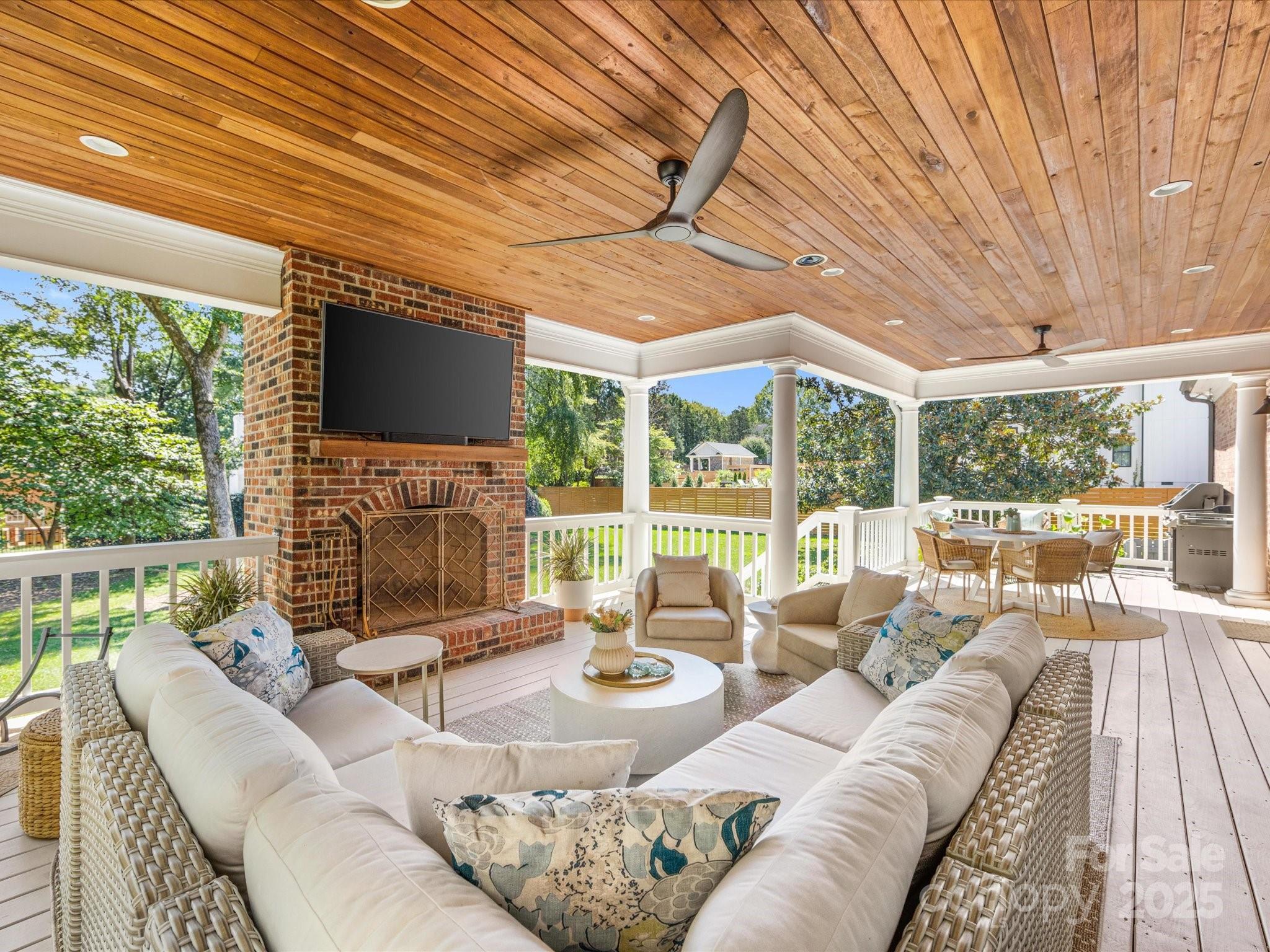 3137 Broadfield Road Charlotte, NC 28226 - Photo 34 of 42 a living room with furniture a flat screen tv and a large window