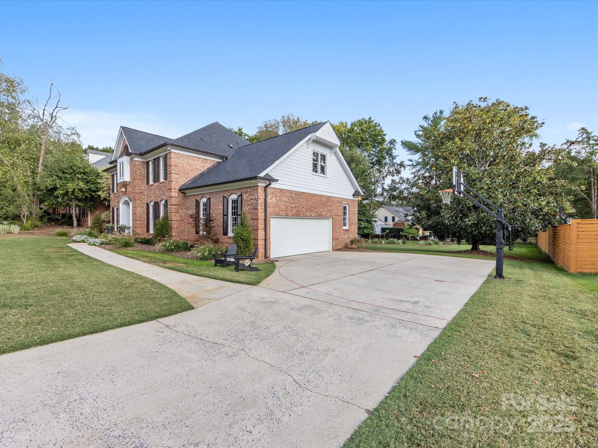 3137 Broadfield Road Charlotte, NC 28226 - Photo 42 of 42 a front view of a house with a yard and trees