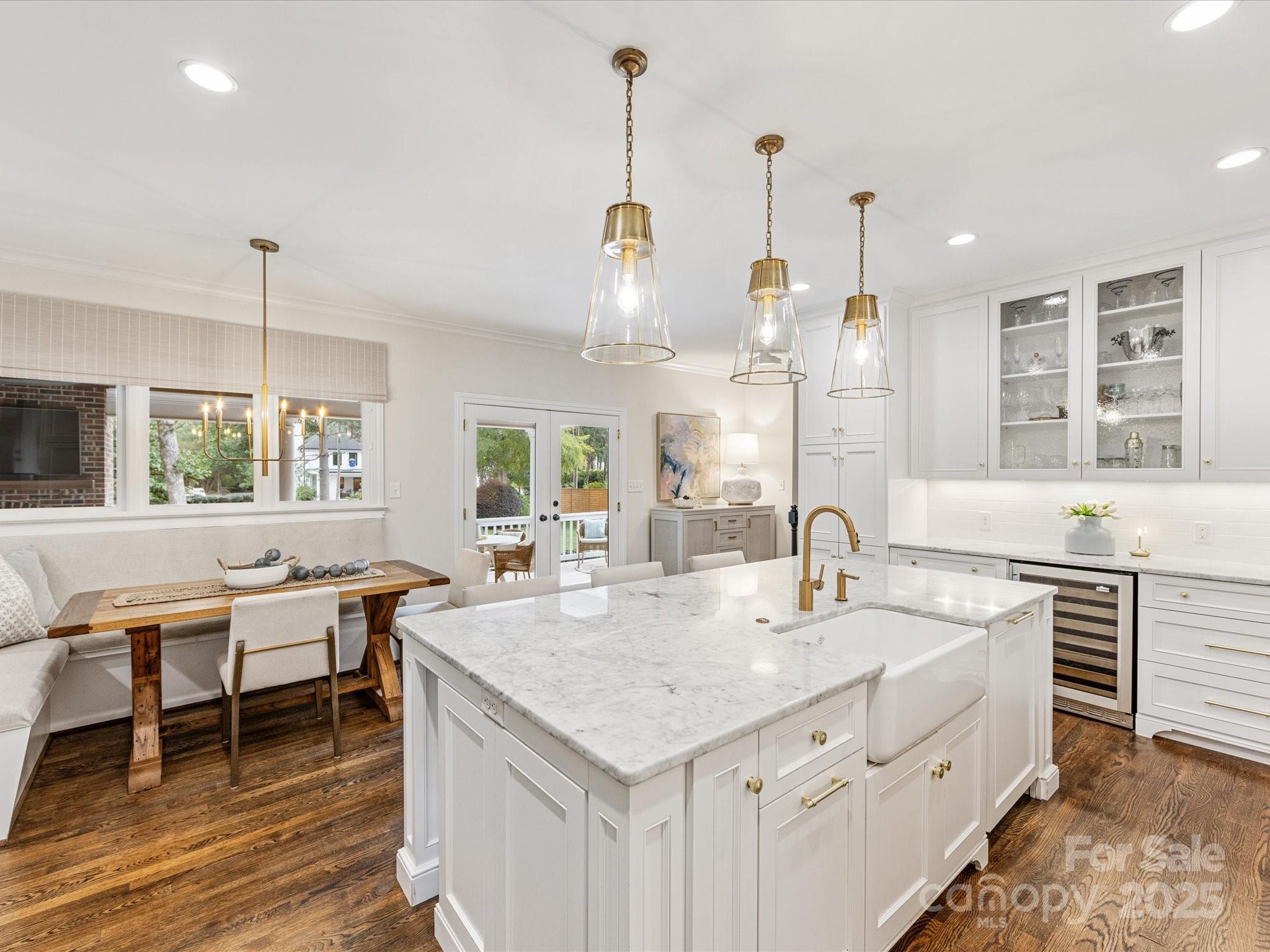 3137 Broadfield Road Charlotte, NC 28226 - Photo 9 of 42 a kitchen with a sink stove and wooden floor