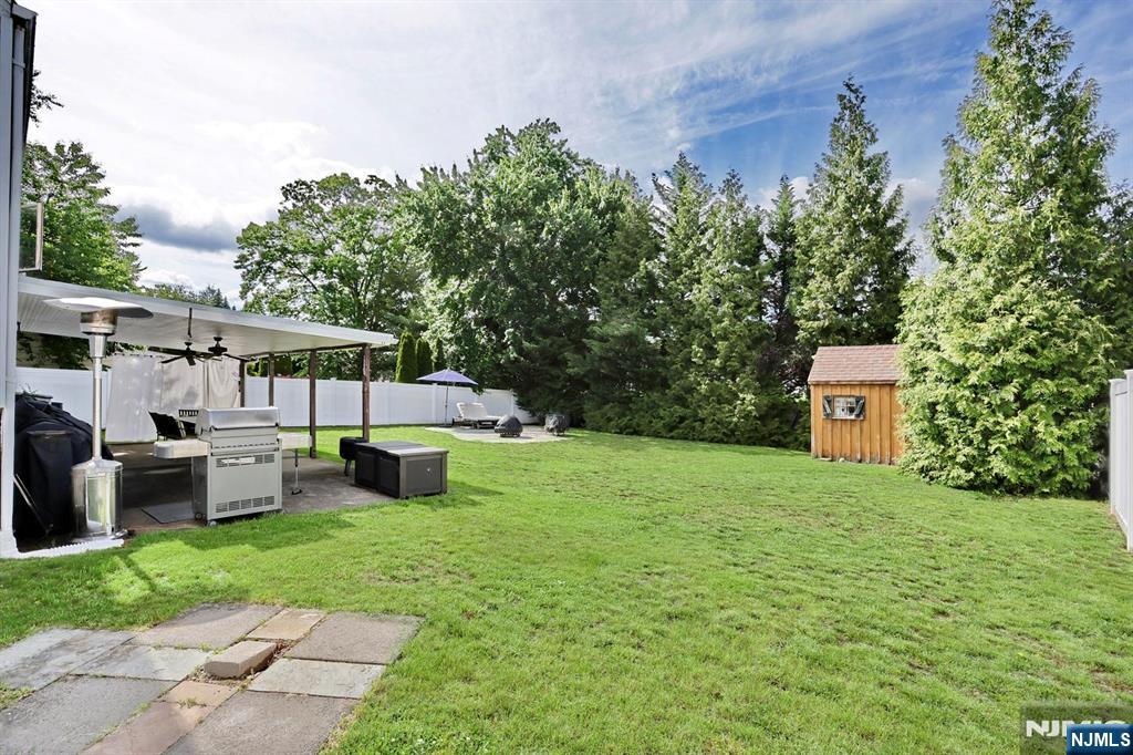87 Barbara Road Dumont, NJ 07628 - Photo 40 of 48 a view of a house with backyard sitting area and garden