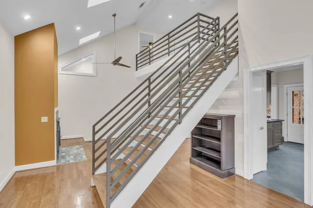 a view of entryway and hall with wooden floor