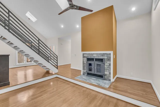 a view of a livingroom with an empty space and a fireplace
