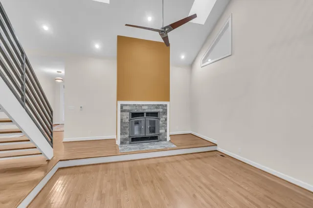 wooden floor in an empty room with a fireplace