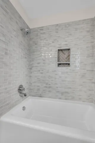 a utility room with cabinets washer and dryer