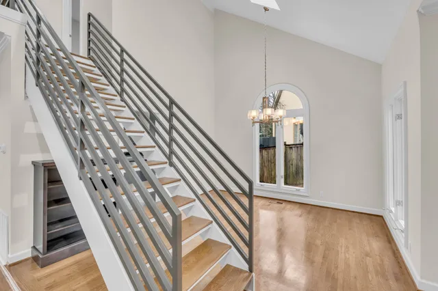 a view of an entryway with wooden floor