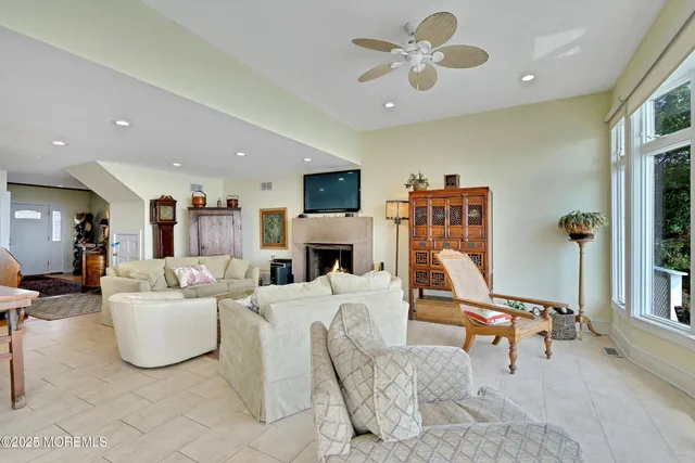a living room with furniture kitchen view and a table