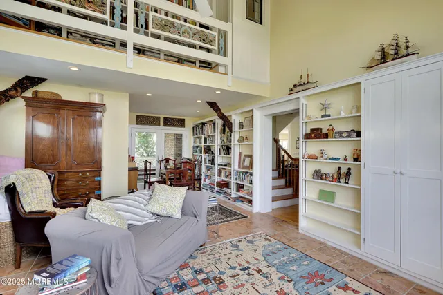 a bed room with a bed and a large window