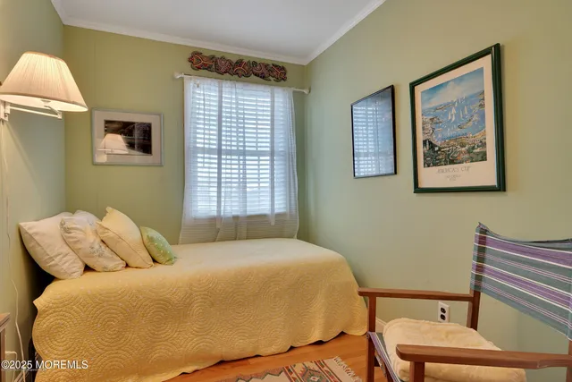 a living room with furniture a rug and white walls