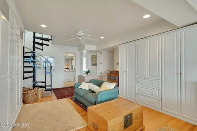 a bathroom with a sink a toilet and a large mirror