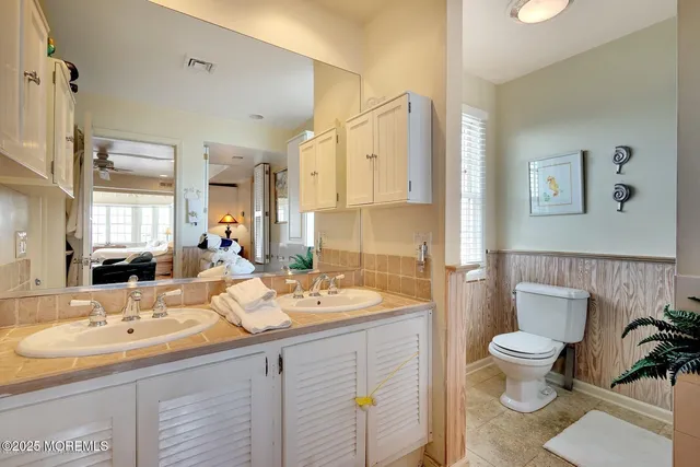a bathroom with a sink and a window
