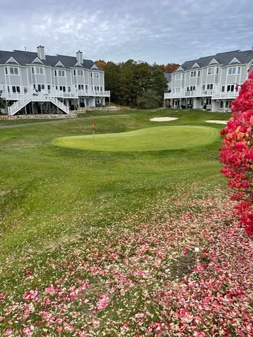 a view of house with a big yard
