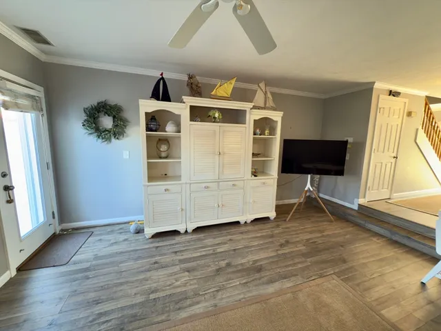 a view of livingroom with furniture and wooden floor