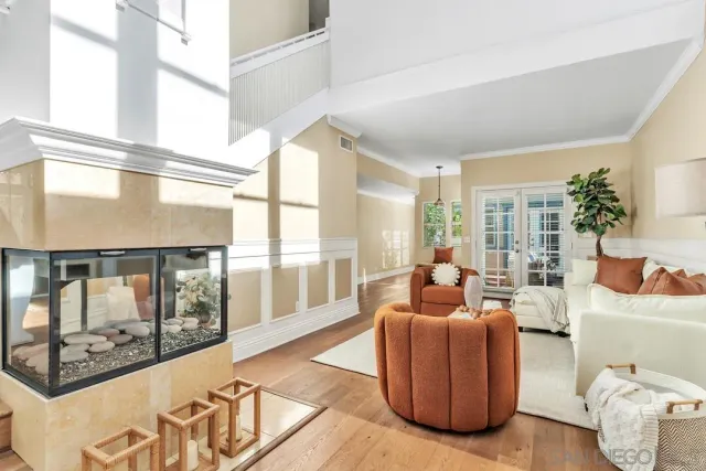 a view of hall way with furniture and floor to ceiling window